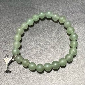 Green beaded stretch bracelet and martini charm